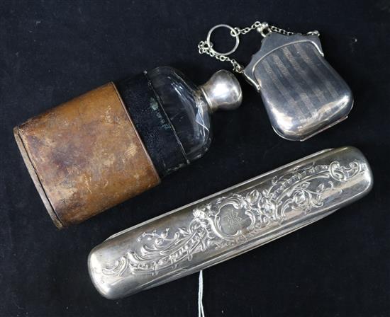 A silver purse, a silver mounted hip flask and a German silver toilet box.